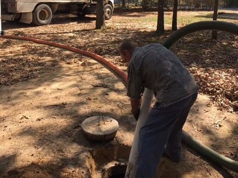 Septic Tank Pumping Little Rock — Man Working on Septic Tank in Mabelvale, AR