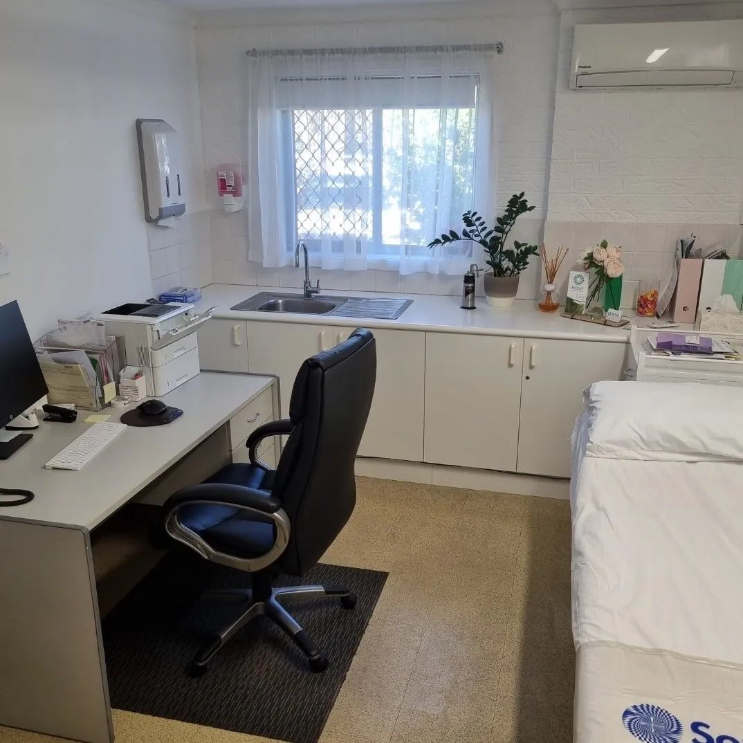 A Doctor 's Office with A Black Chair and A Computer — Tuncurry Medical Centre In Tuncurry, NSW