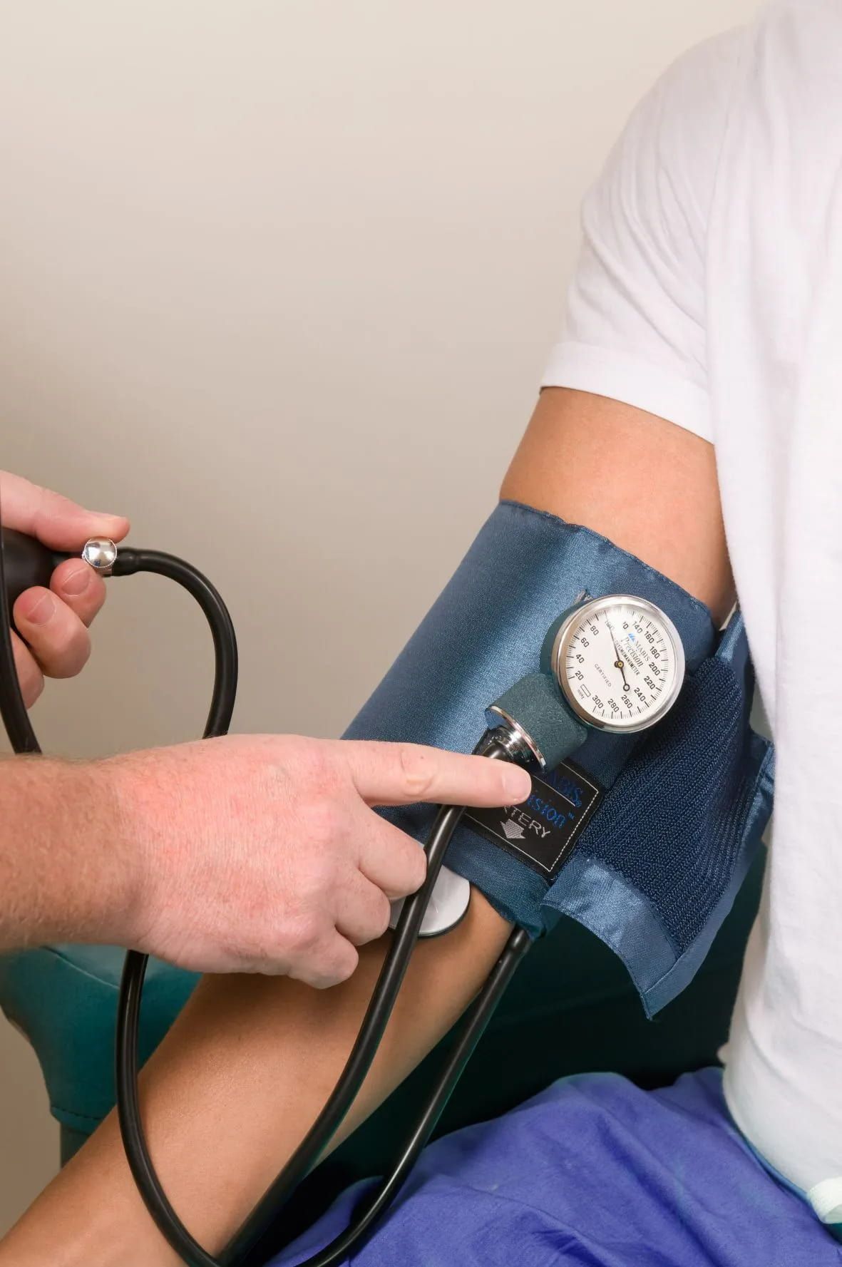 A Healthcare Professional Is Measuring a Patient's Blood Pressure Using a Manual Sphygmomanometer and Stethoscope — Tuncurry Medical Centre In Tuncurry, NSW