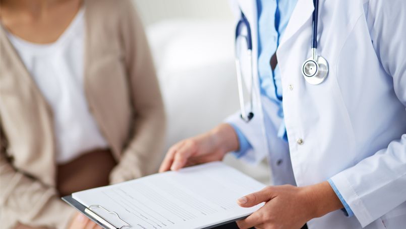A Doctor Is Holding a Clipboard in Front of A Patient — Tuncurry Medical Centre In Tuncurry, NSW