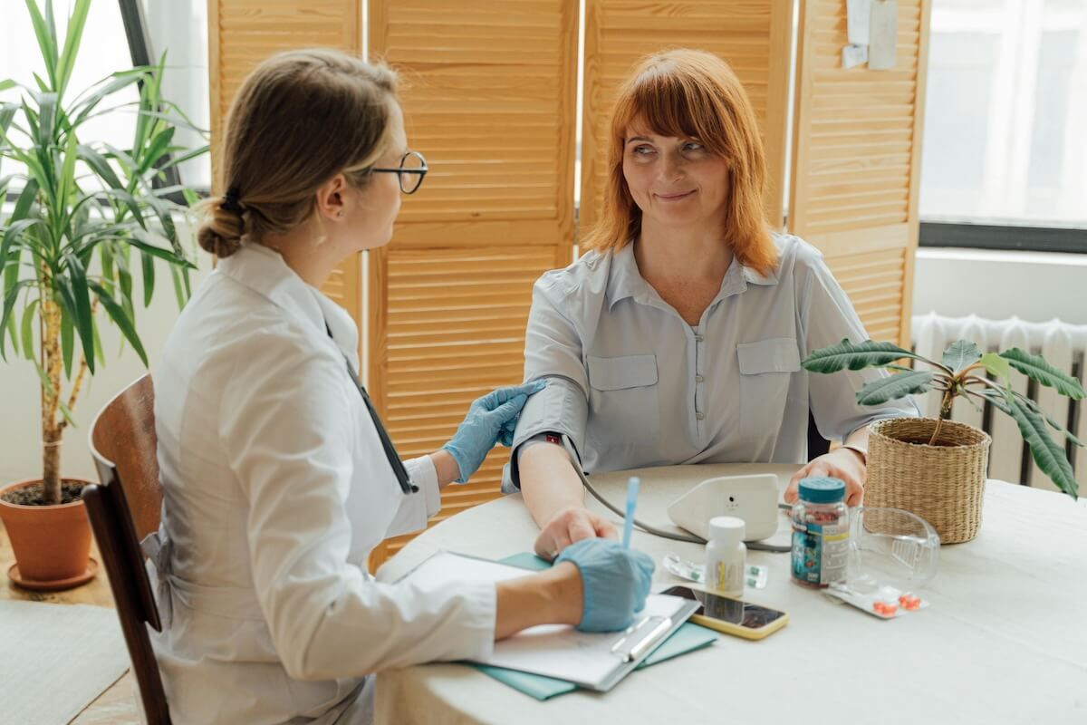 A woman having a consultation with a doctor — Tuncurry Medical Centre In Tuncurry, NSW
