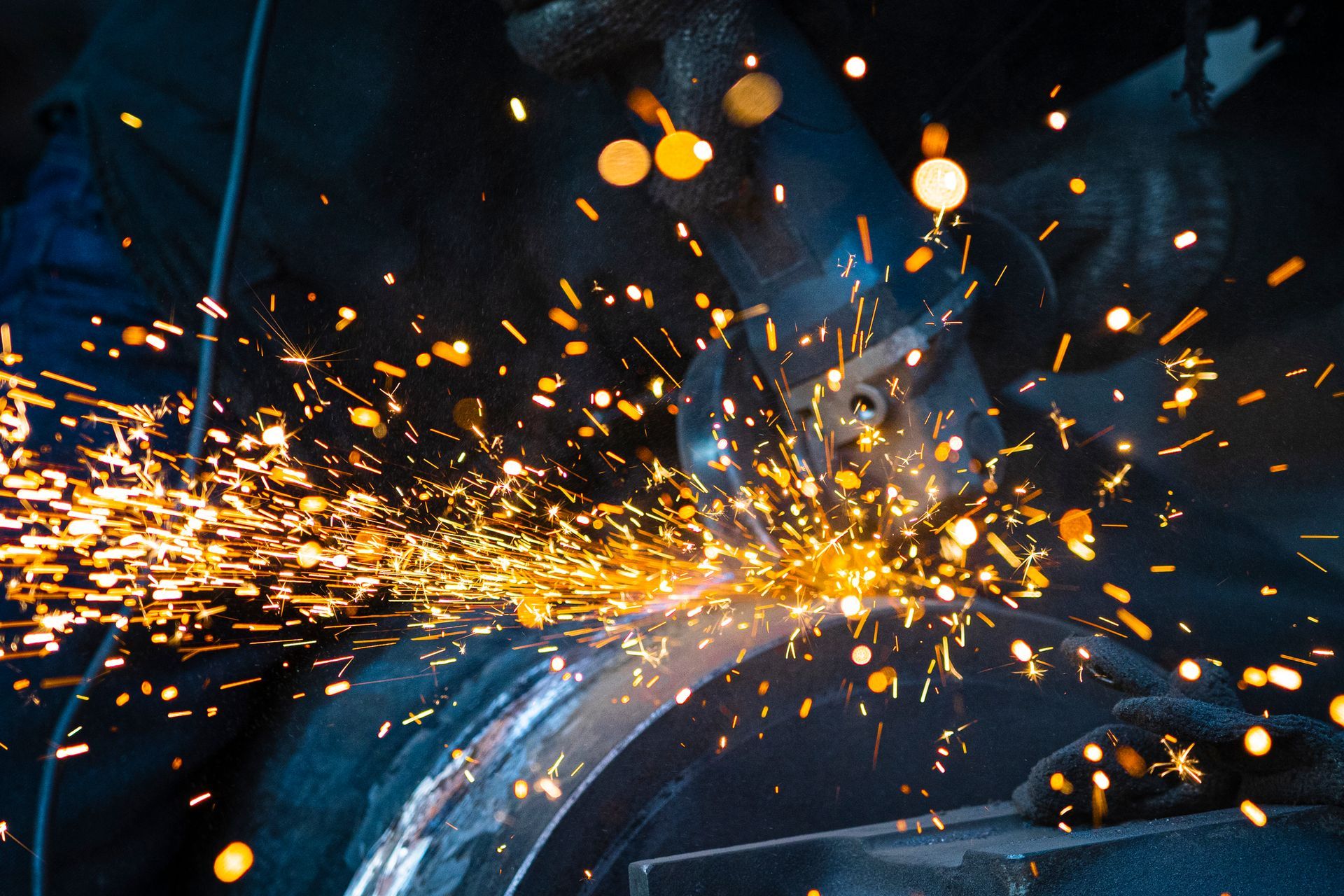 Sparks from grinding on metal work.