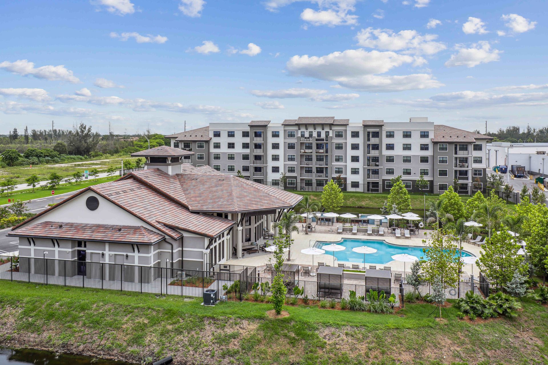 Charlotte, NC skyline silhouetted against an orange and blue sunset.