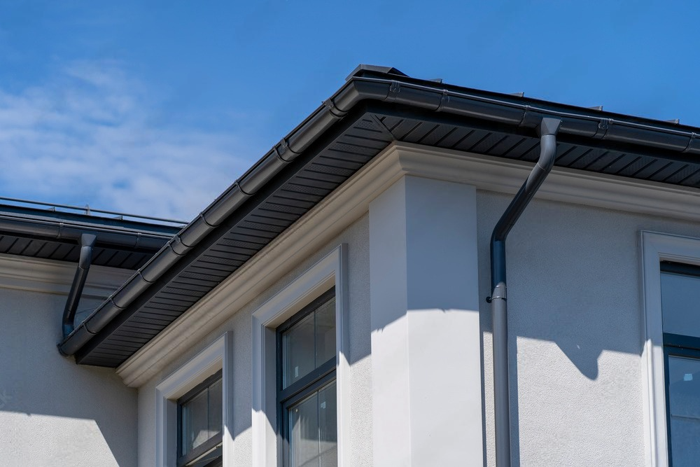 A skilled worker repairing a damaged roof, meticulously replacing shingles and reinforcing the structure to ensure durability and protection against the elements.