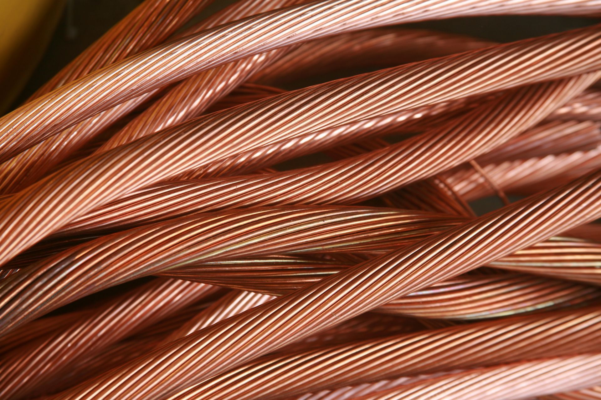 Close-up of twisted copper wire; strands are a reddish-brown color.
