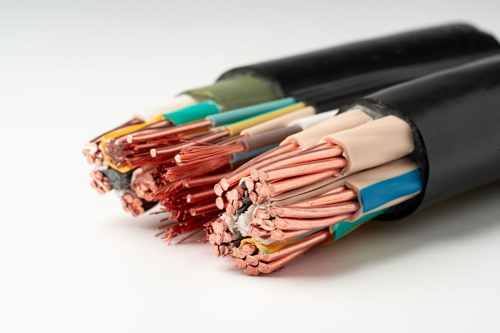 Bundled electrical cables with multiple colored wires exposed. Copper wires are visible.