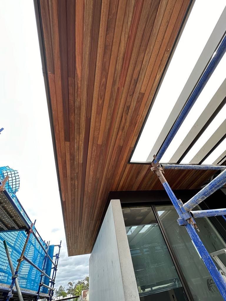 A building under construction with a wooden ceiling and scaffolding.