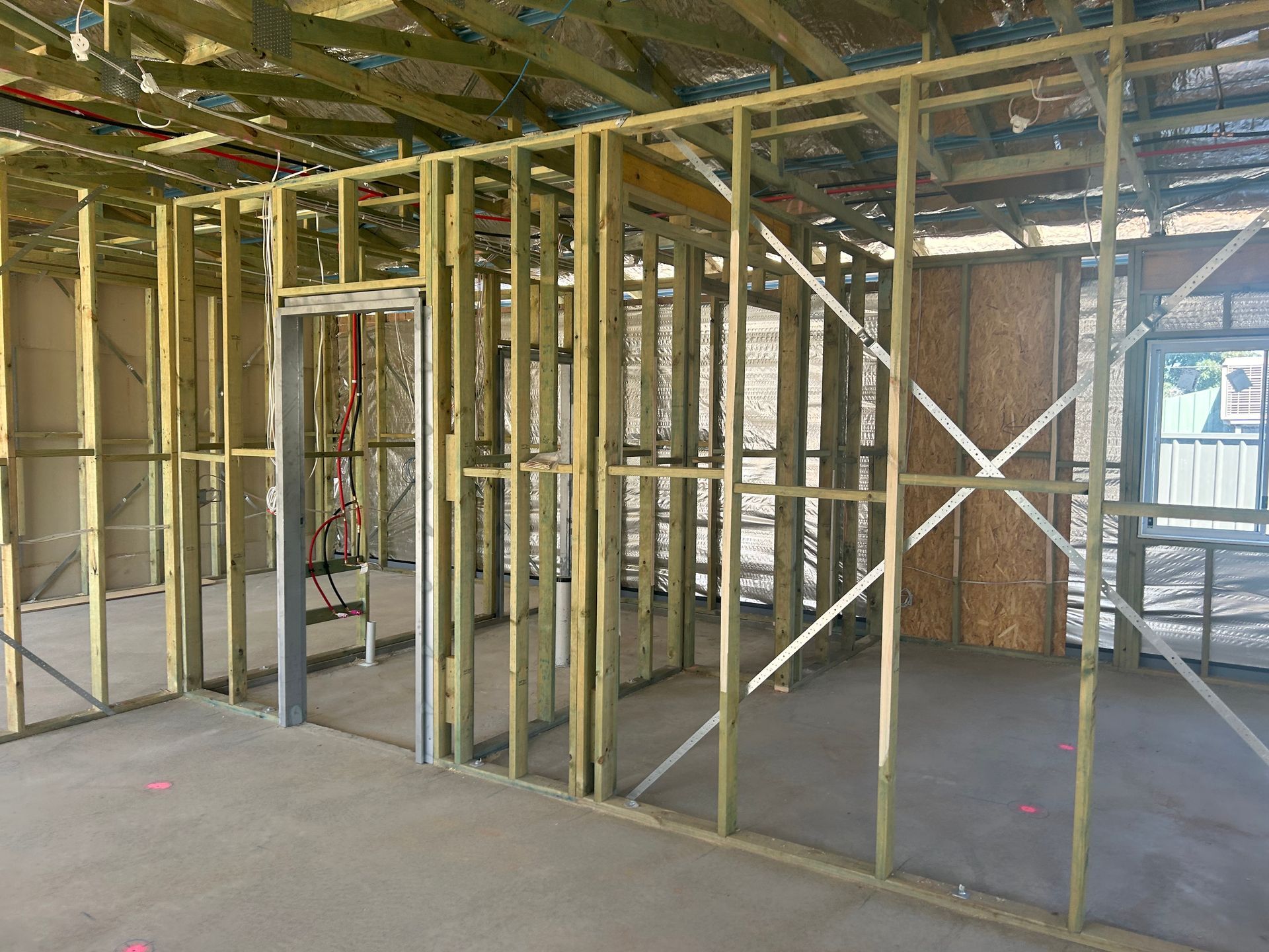 A room with a lot of wooden frames in it