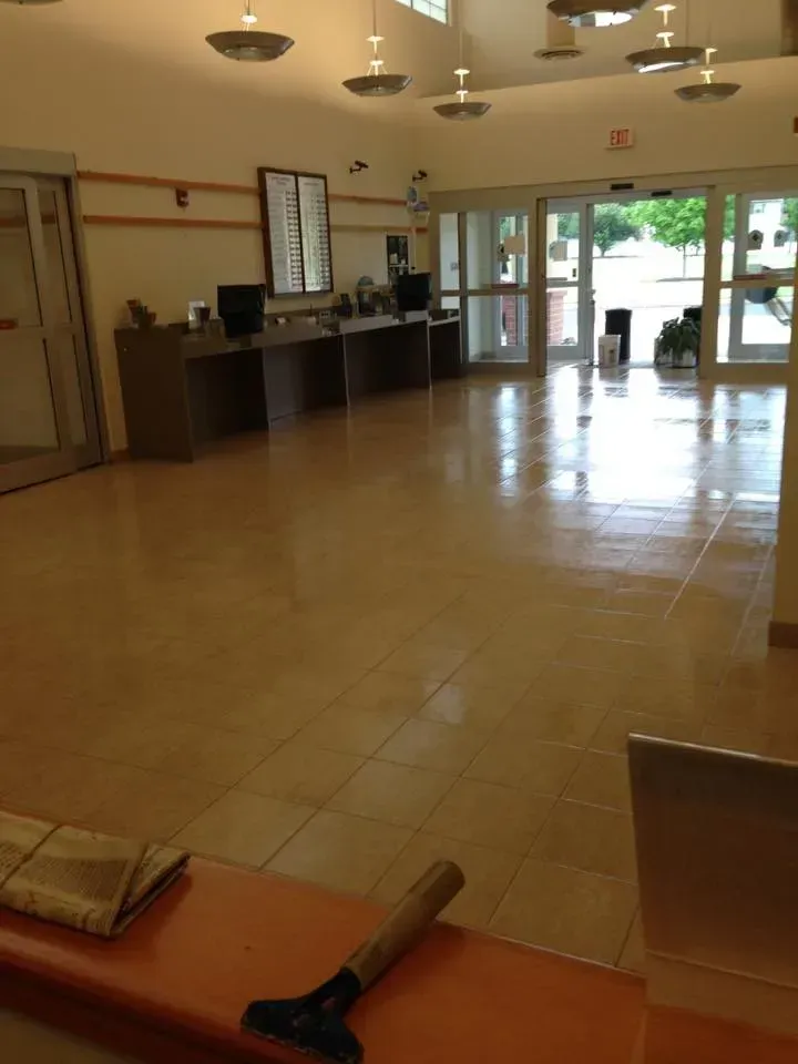 A large empty room with a hammer on the counter