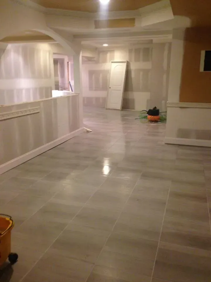 There is a vacuum cleaner in the middle of the room.