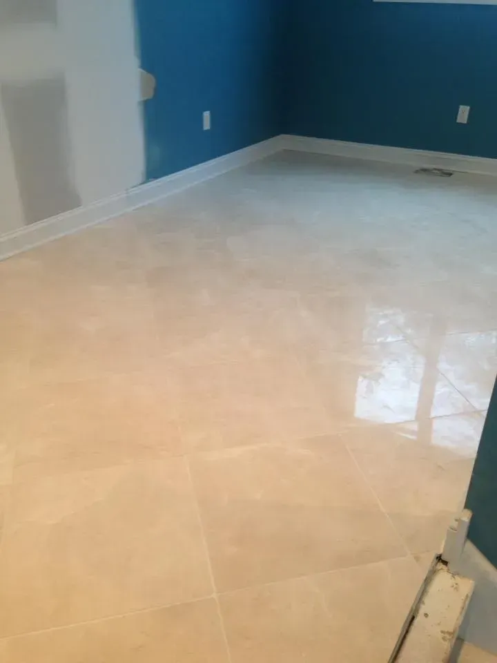 A room with a tiled floor and blue walls.