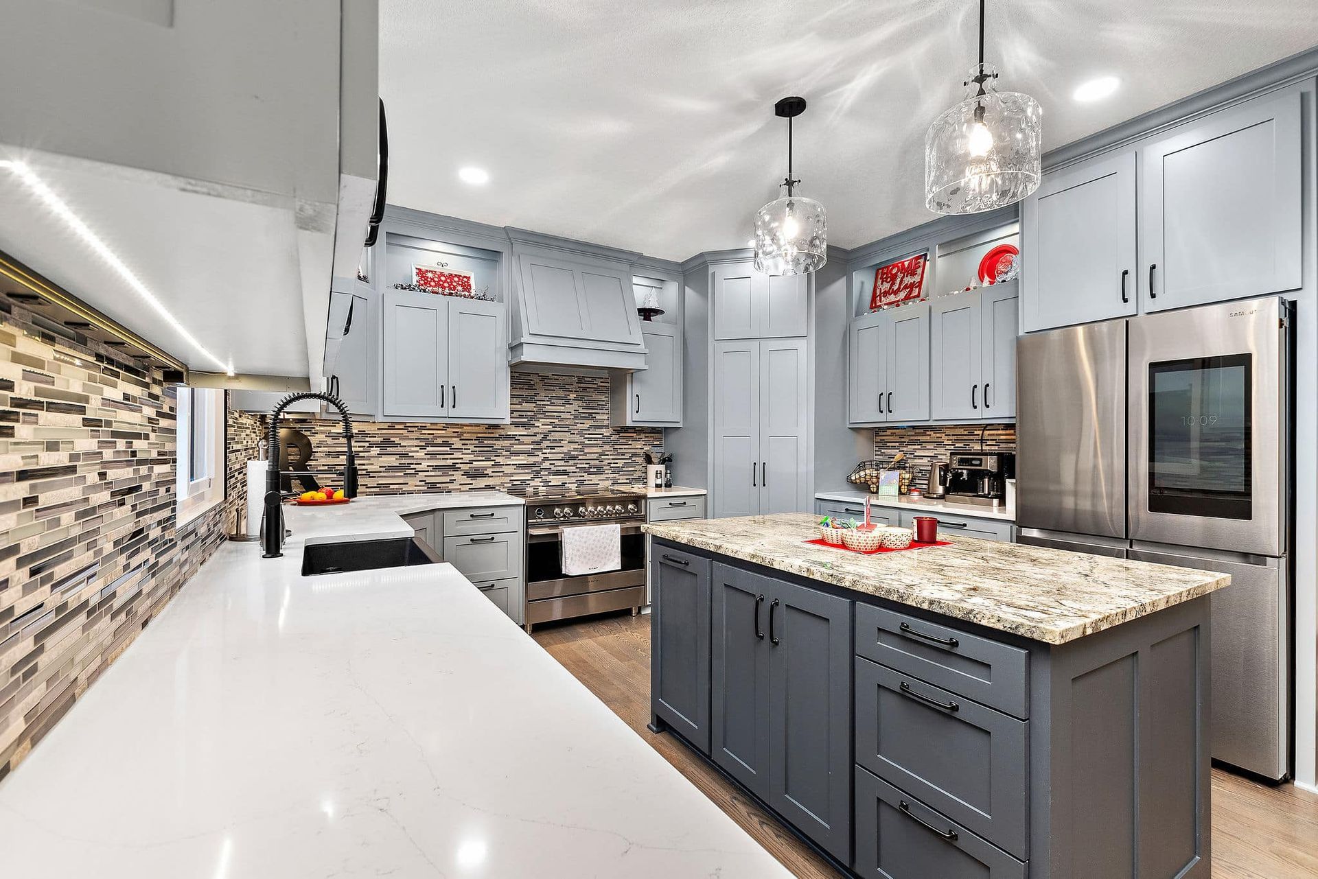 There is a large island in the middle of the kitchen.