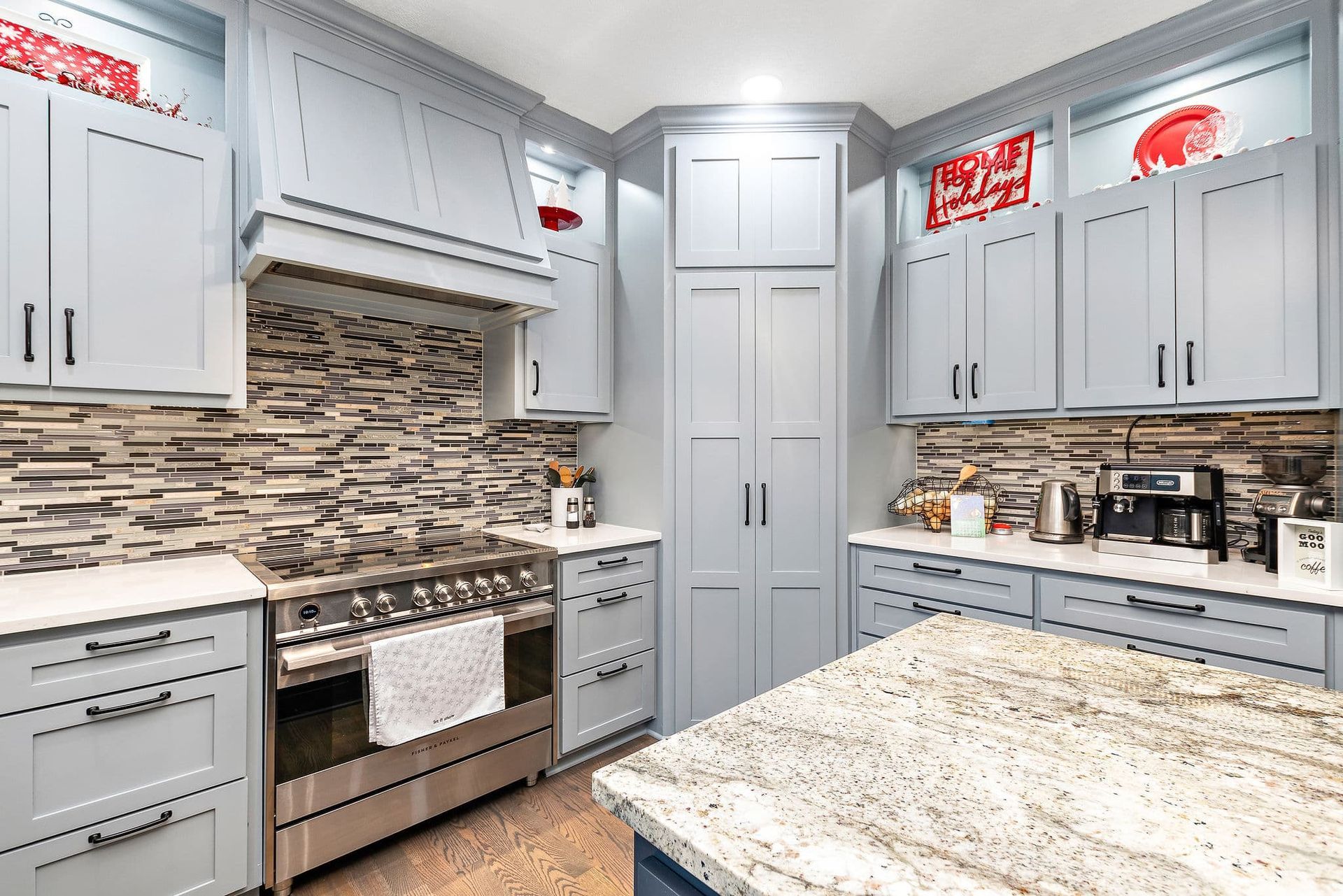 A kitchen with stainless steel appliances and granite counter tops.