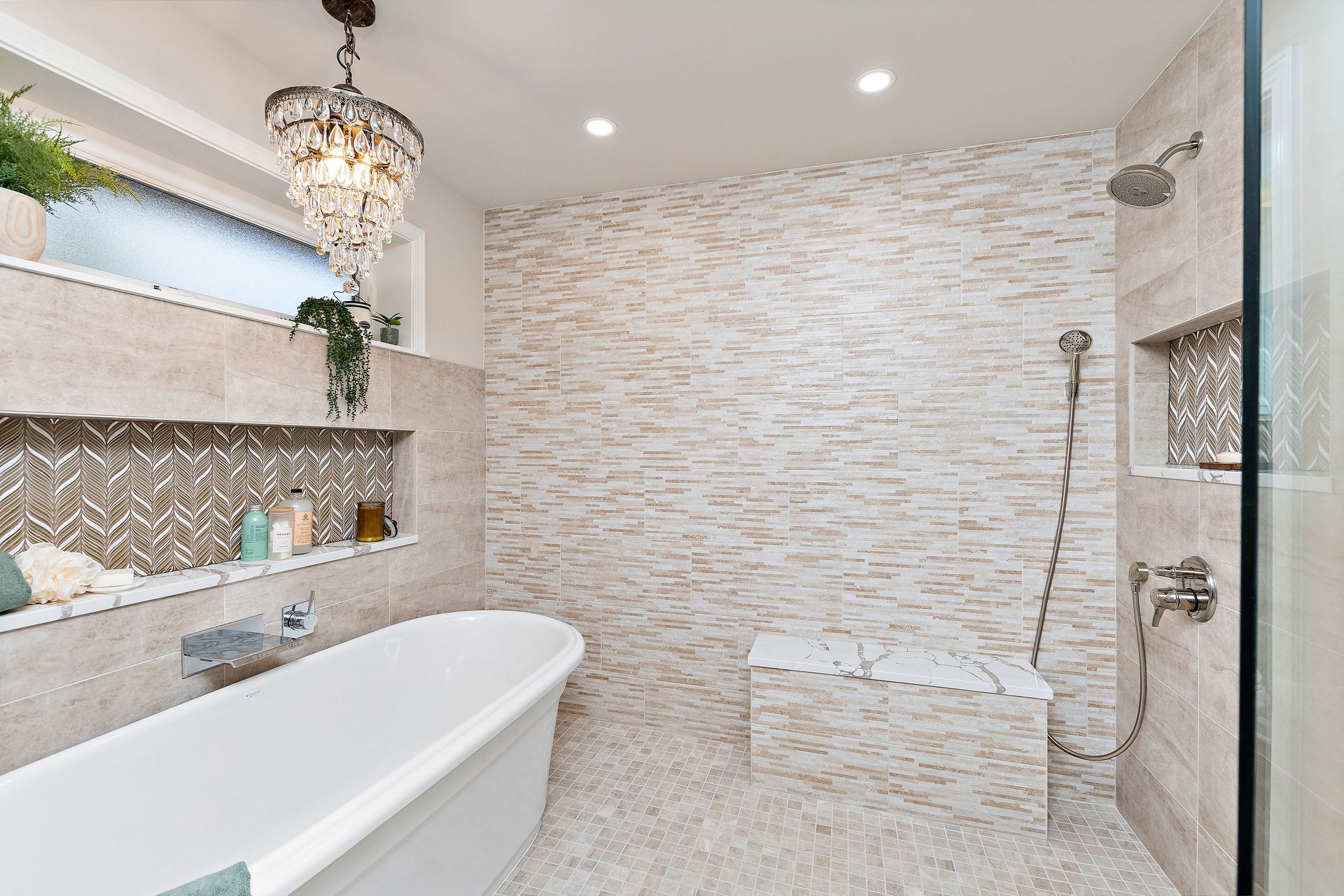 A bathroom with a bathtub and a walk in shower.