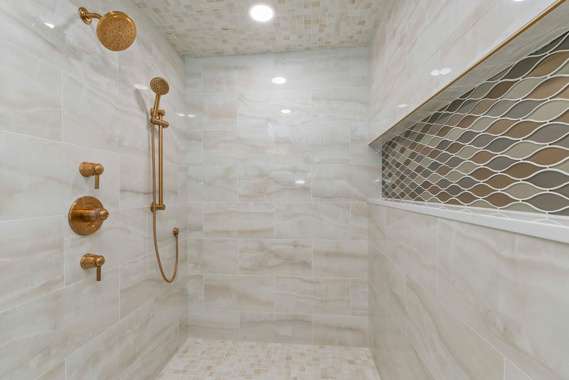 A bathroom with a walk in shower and a window.