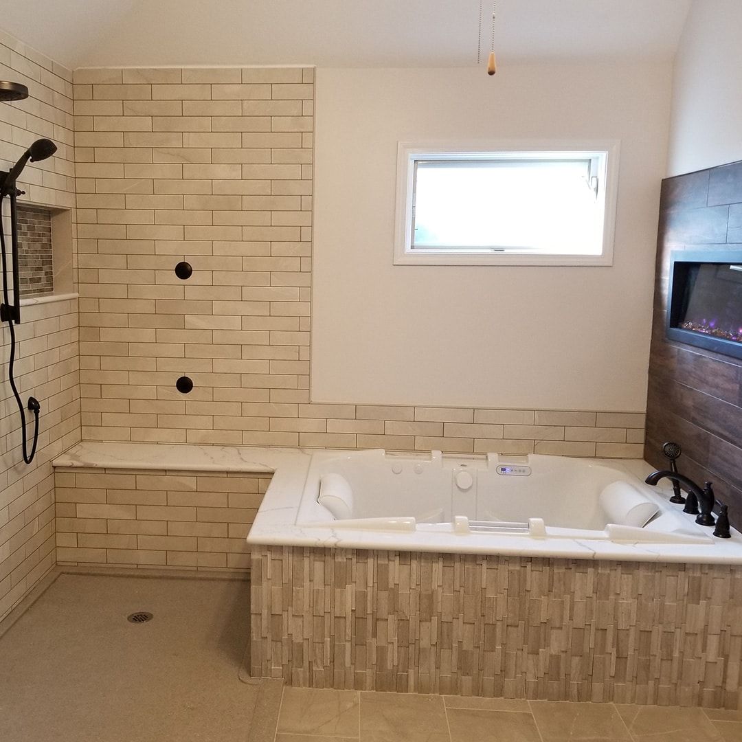 A bathroom with a jacuzzi tub and a shower