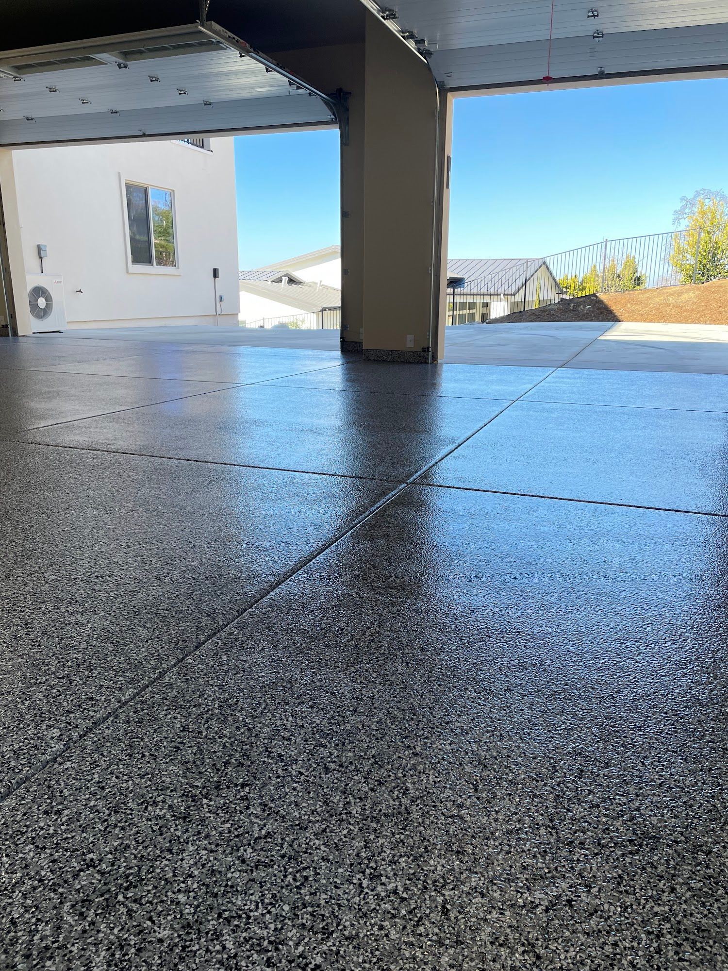 Granite countertops in a kitchen, partially covered with protective plastic.