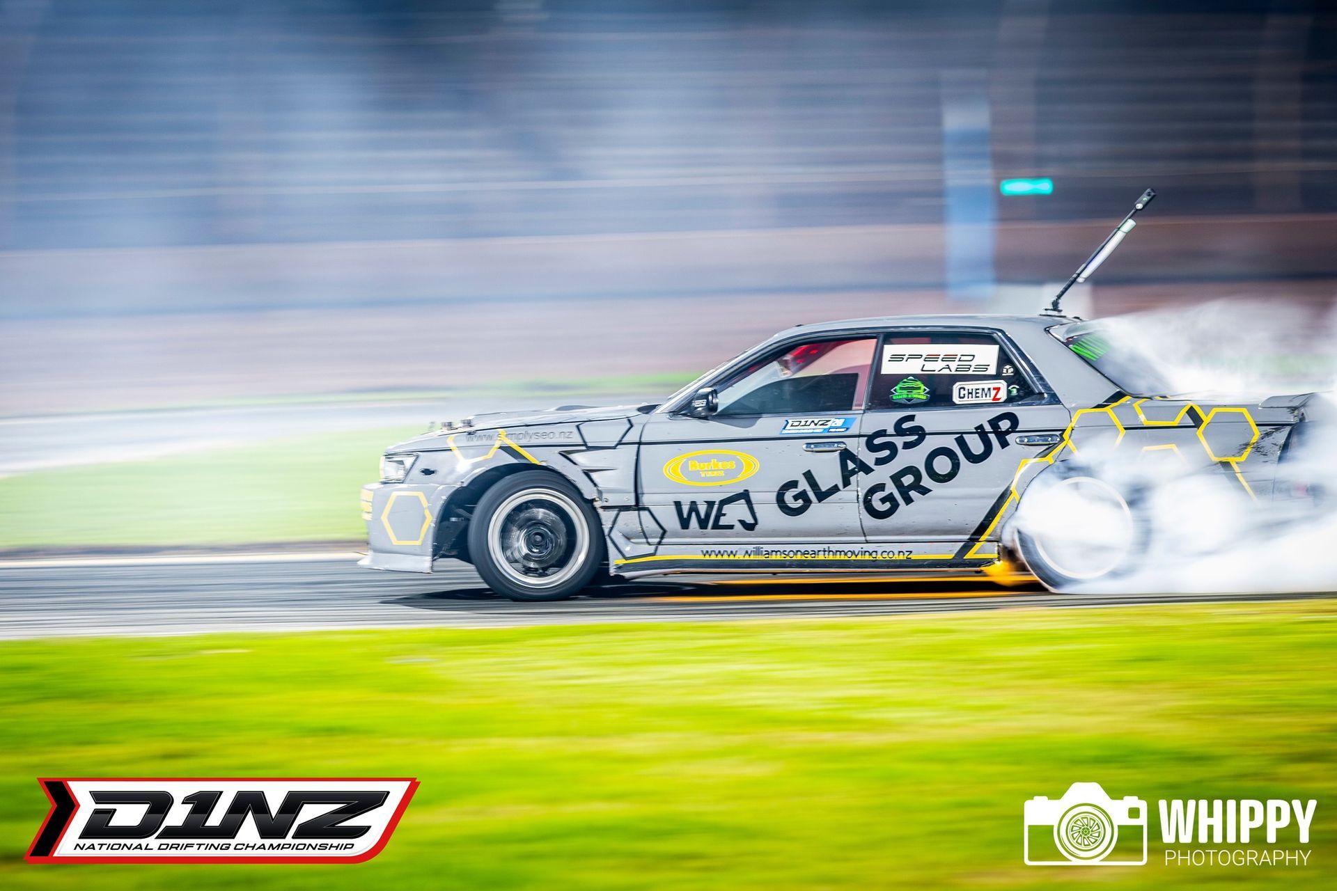 CamGoDrift drifting at D1NZ with smoke coming out of the tires.