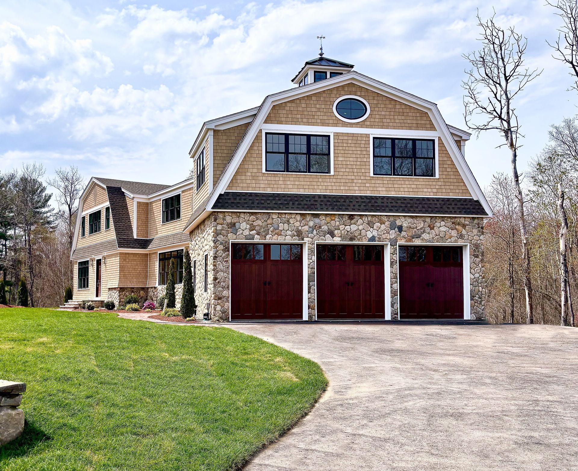 A large house with a driveway leading to it