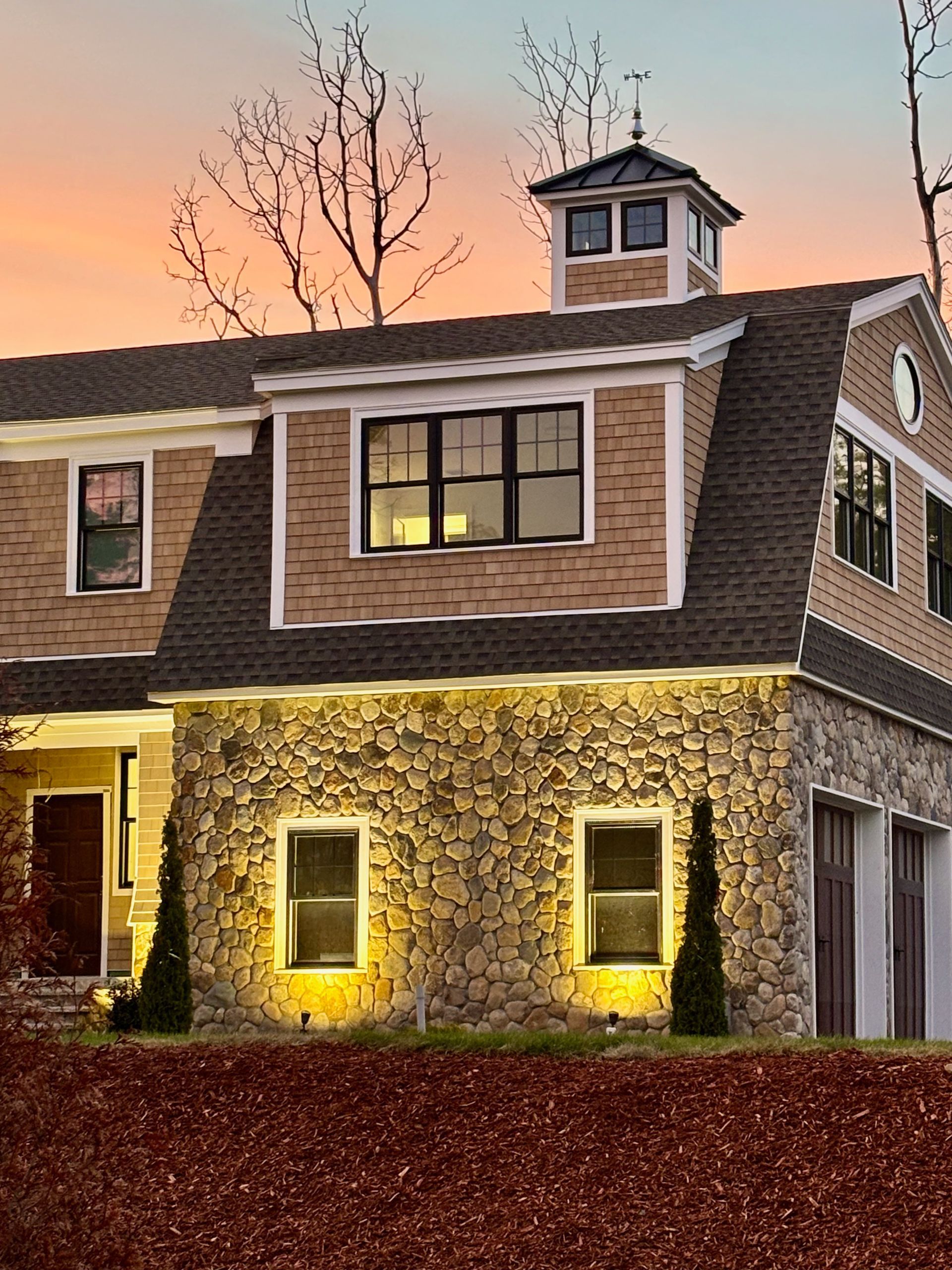 A large house with a clock tower on top of it