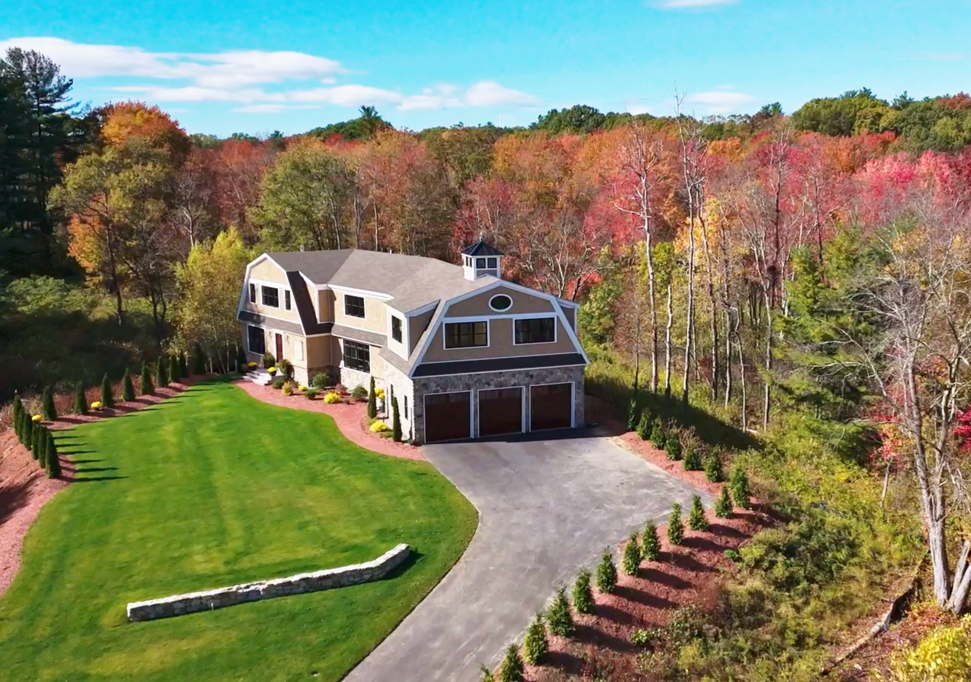 A large house with a large lawn in front of it