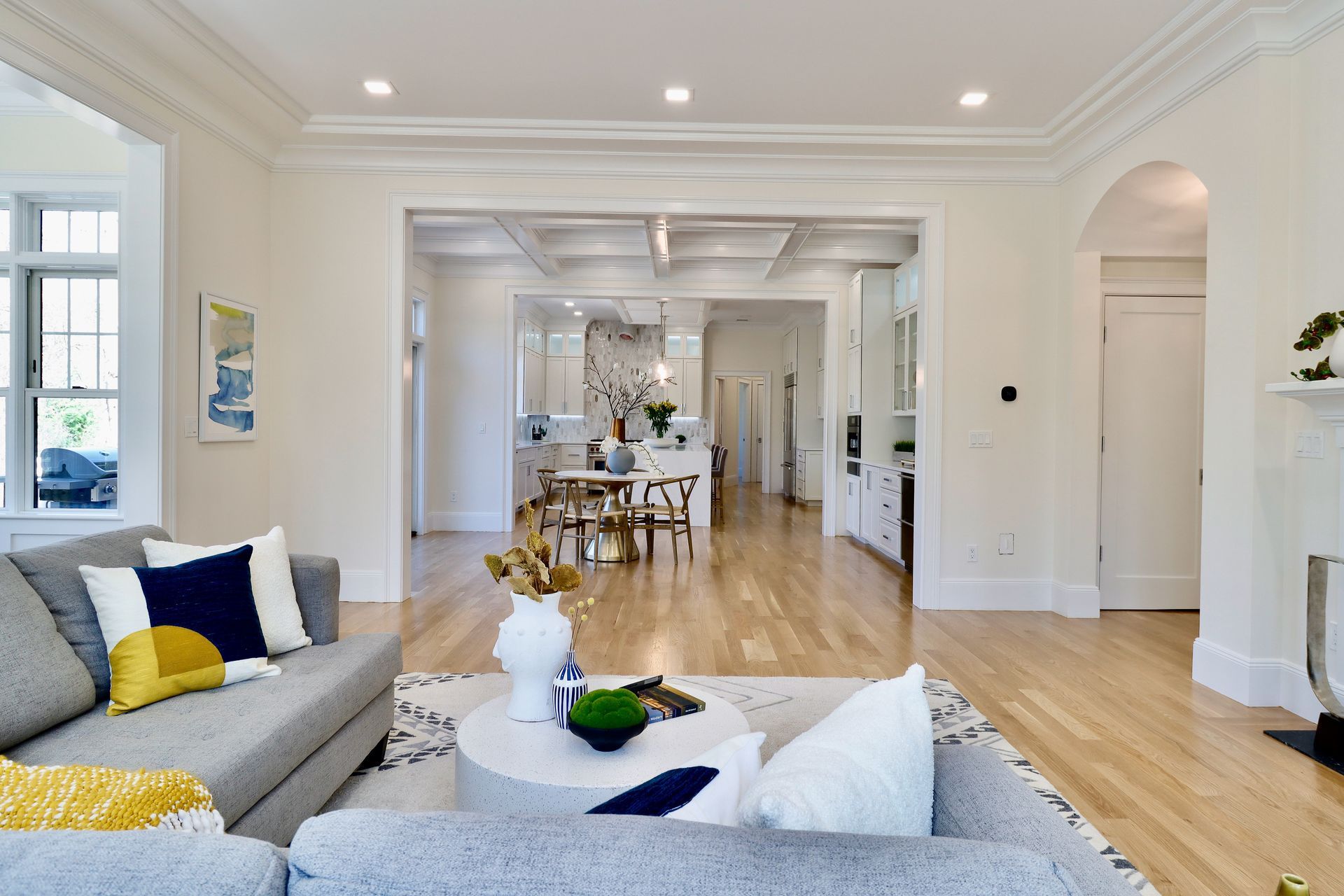 A living room with a couch , coffee table , and fireplace.