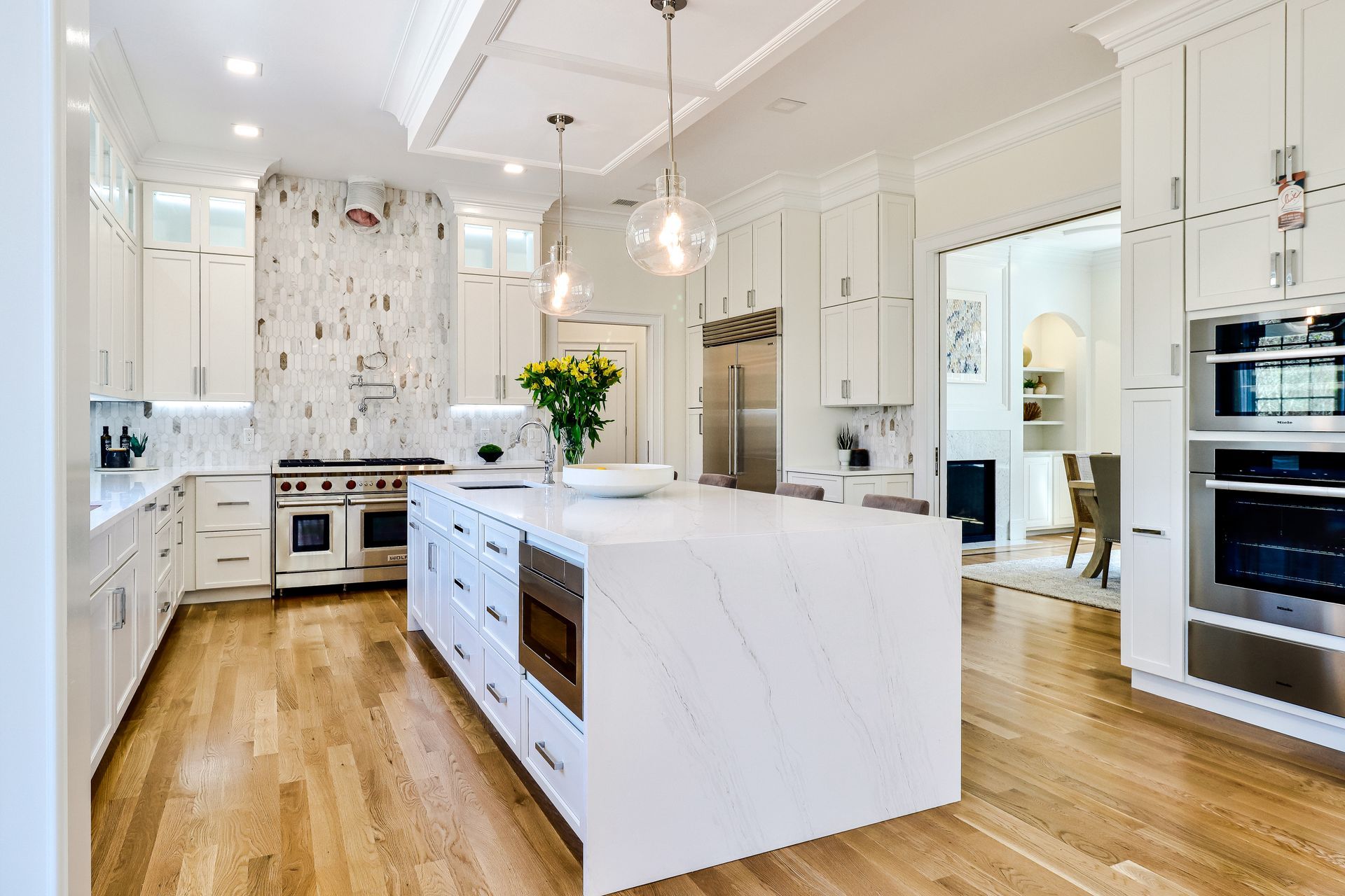 There is a large island in the middle of the kitchen.