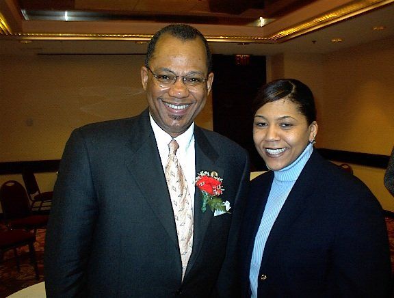 A man and a woman are posing for a picture together