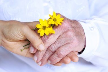 Hands Holding Flowers