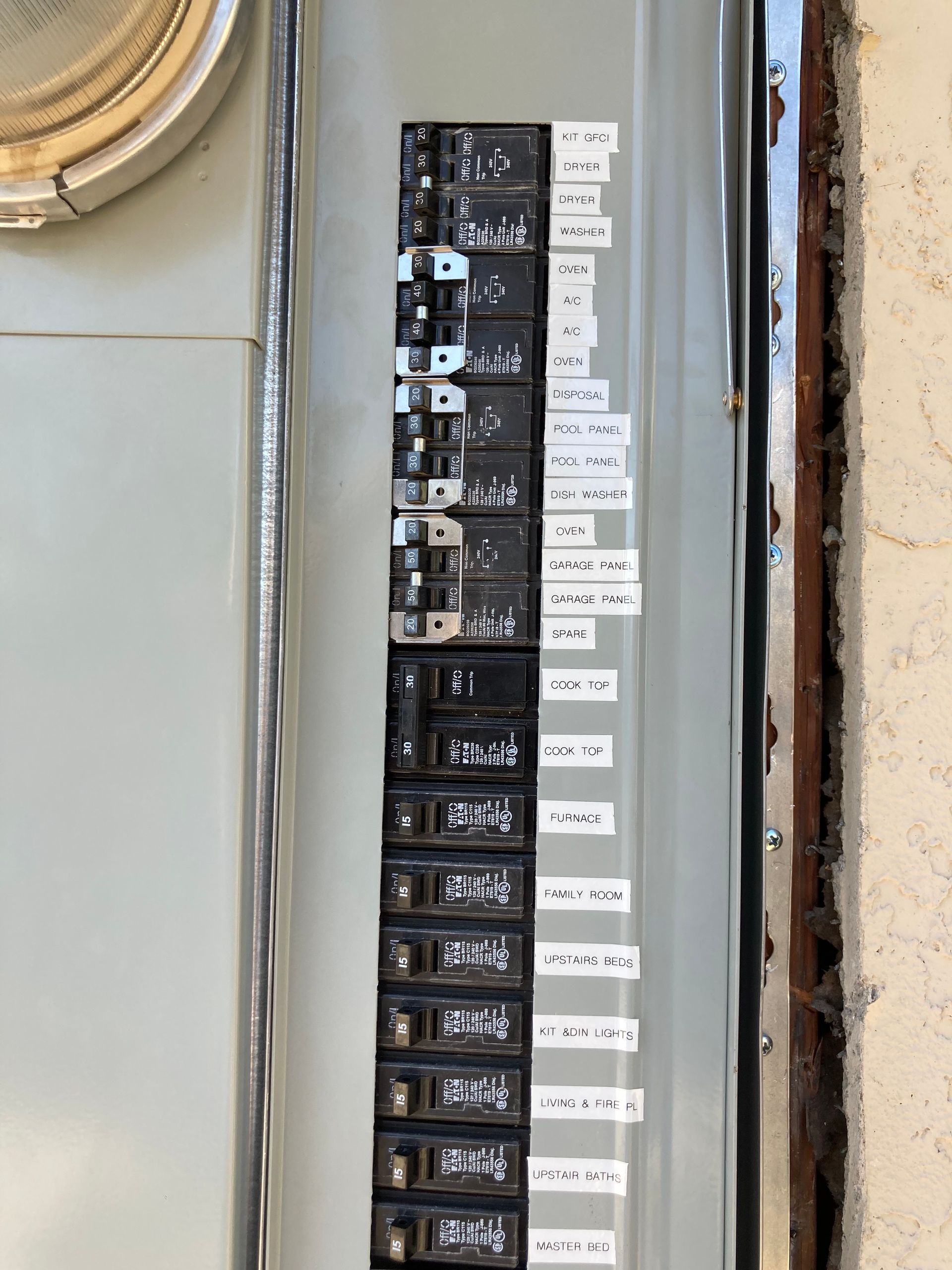 A close up of a electrical panel on a wall.