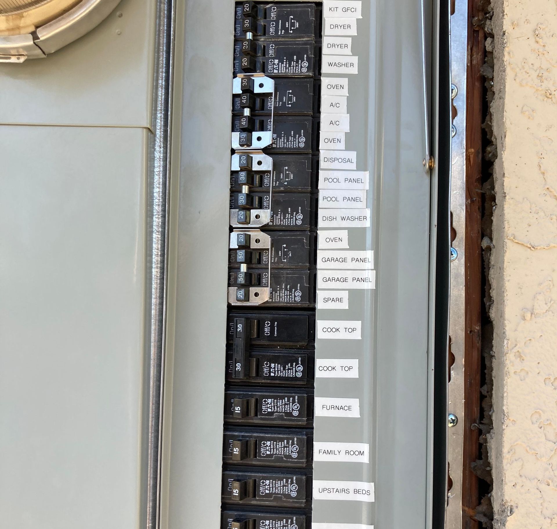 A close up of a electrical panel with labels on it