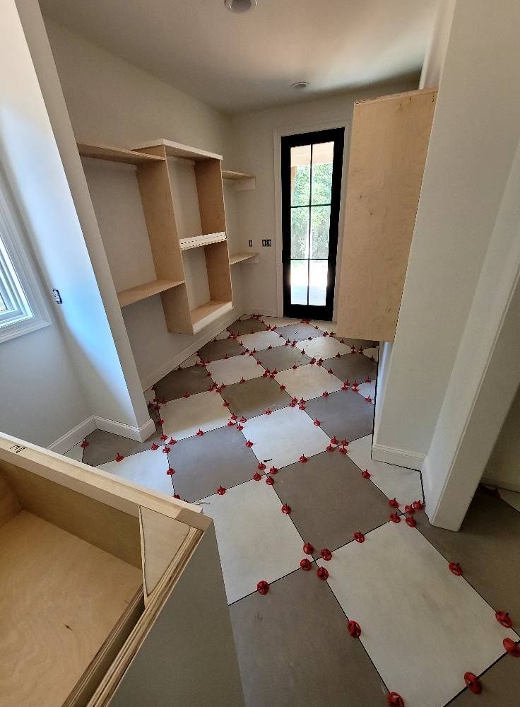 A room with a checkered floor and a window.