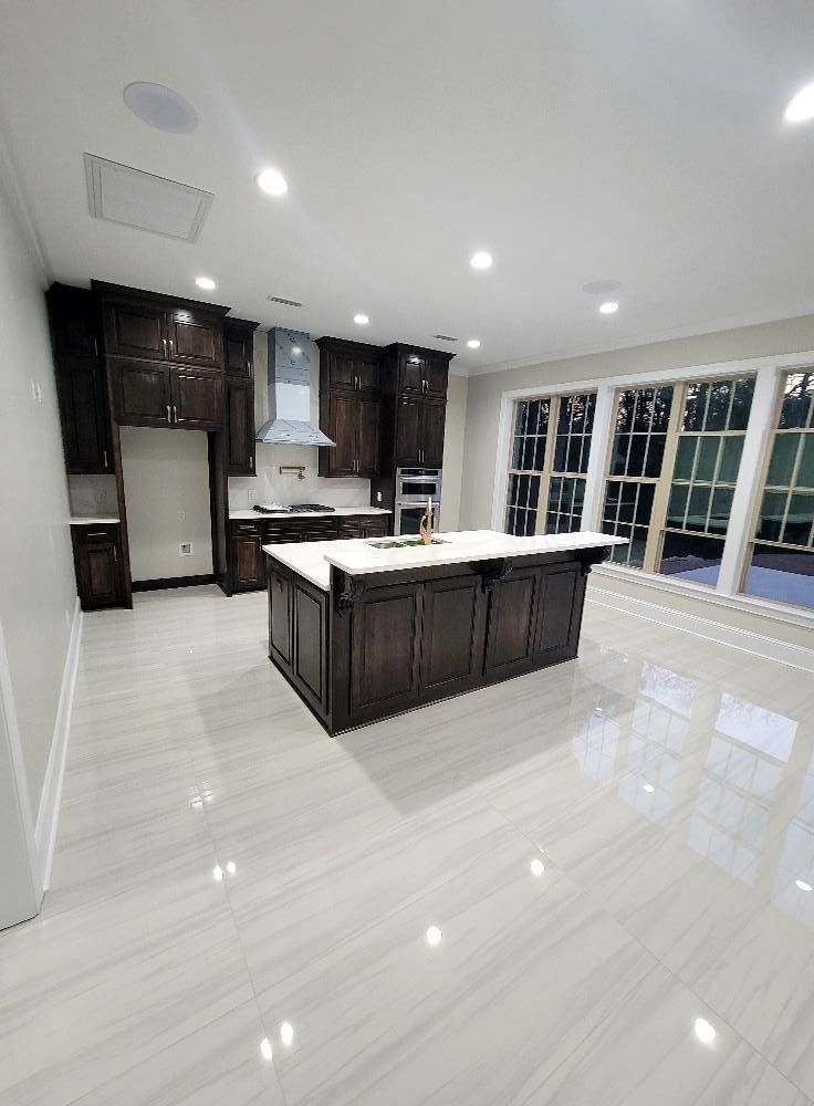A kitchen with a large island in the middle of the room.