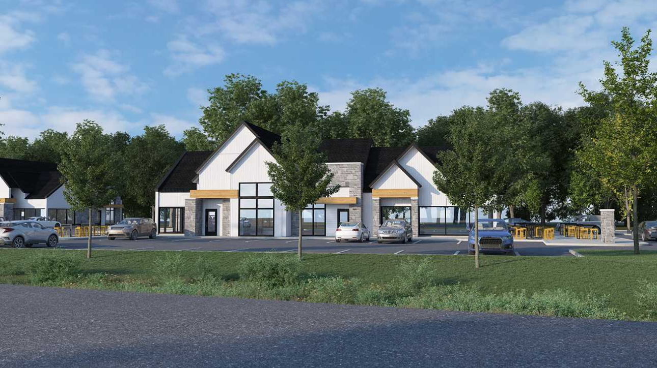 Une impression d'artiste d'un bâtiment avec des voitures garées devant lui.