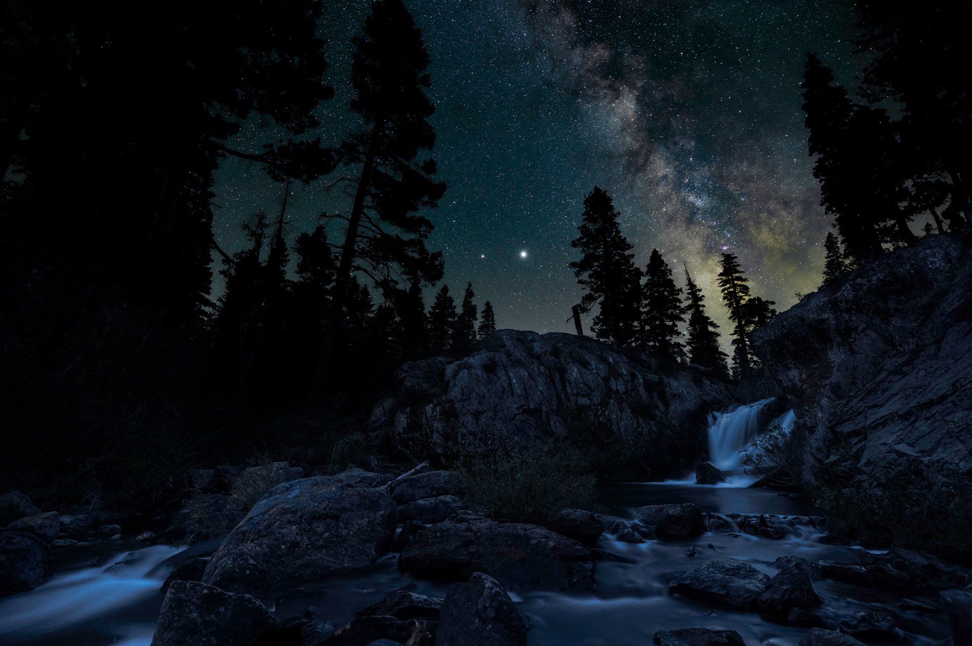 The Milky Way above Graeagle Falls in Northern California. Saturn and Jupiter are the two bright stars in the center. (Two image composite)