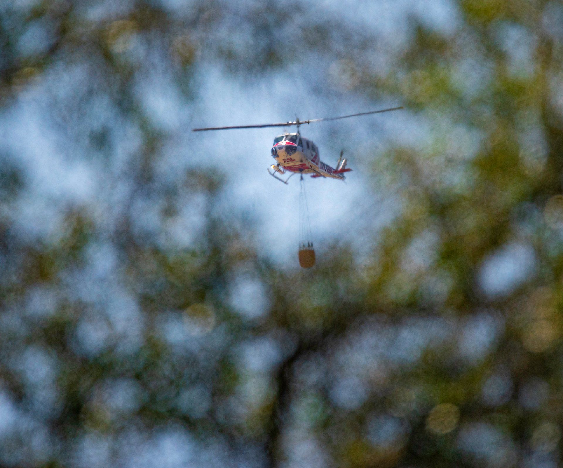 CalFire's Boggs Mountain Helitack moves in for a drop on a fire along Berryessa-Knoxville Road in northern Napa County, California.