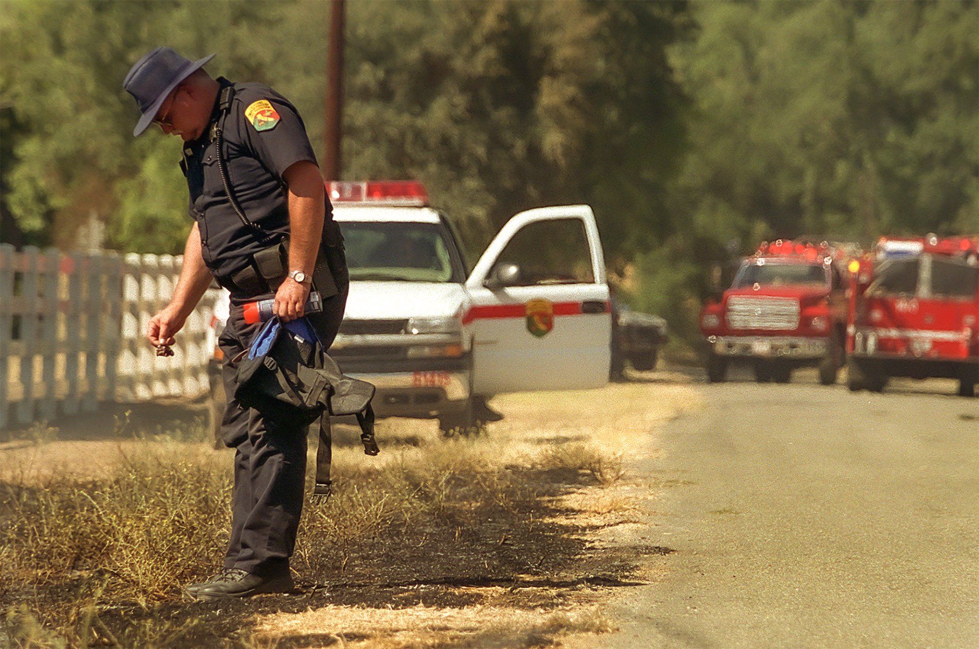 CalFire Captain Dan Eddleman looks for clues to the cause of a 20 acre fire on Berryessa-Knoxville Road in Napa County, California.