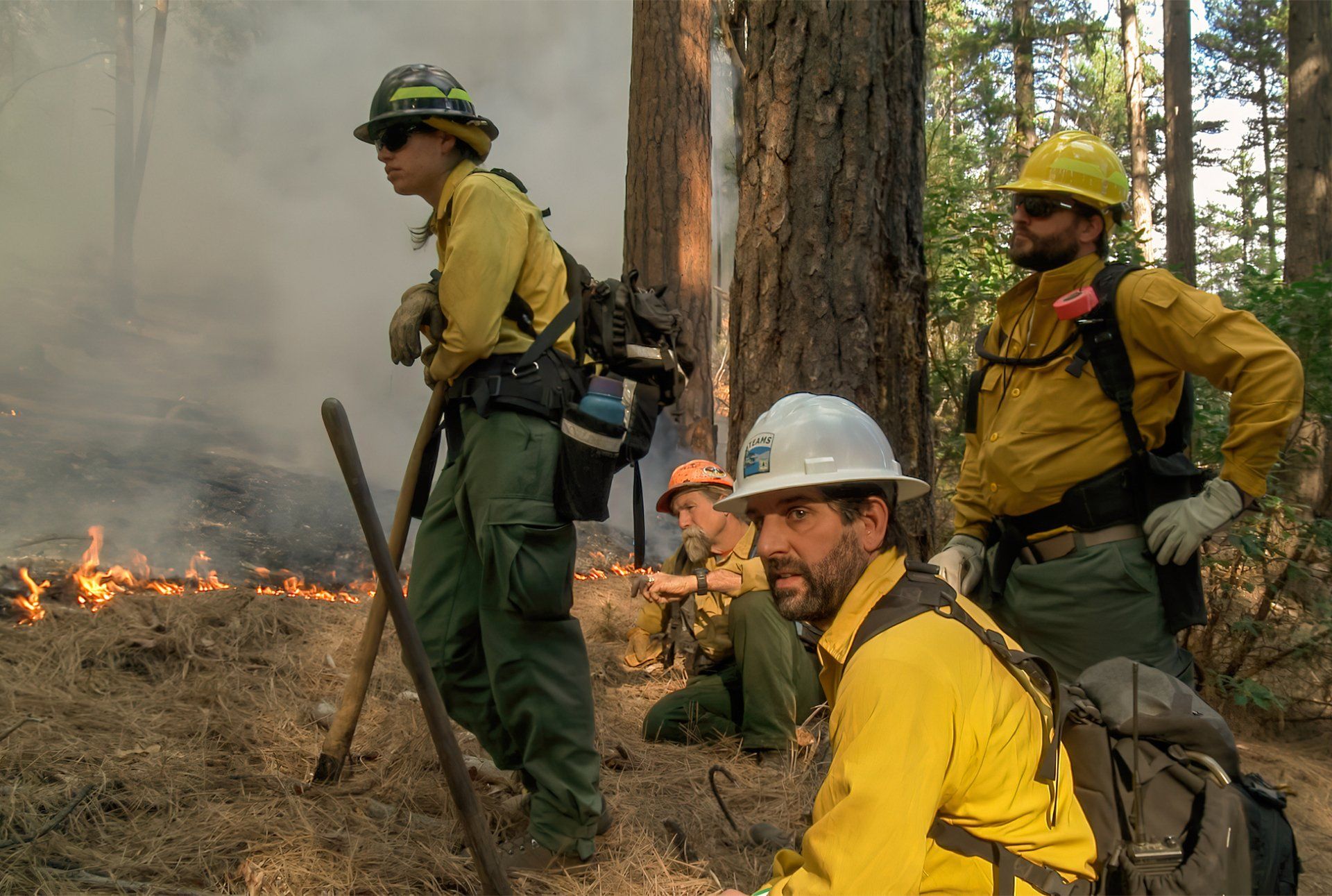 A fire crew keeps a watchful eye on a prescribed fire above Weaverville, California.