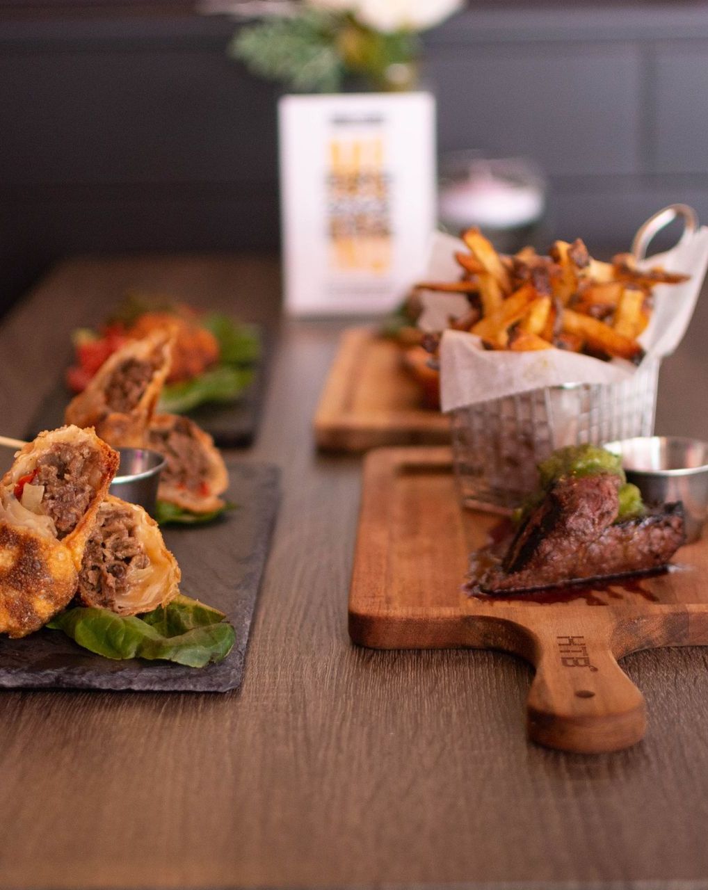 A wooden cutting board with the word beef on it