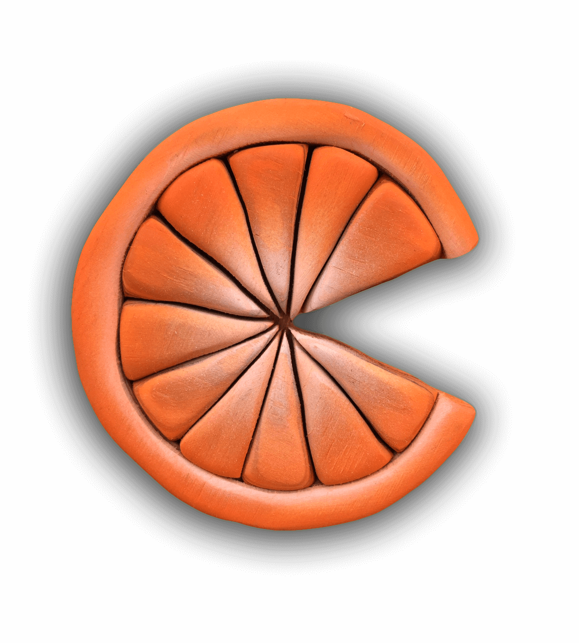 A custom Intarsia Art piece by Nick Vidakovic of a slice of orange with a bite taken out of it