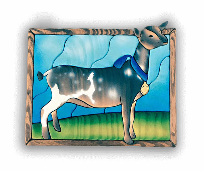 A custom Intarsia Art piece by Nick Vidakovic of a goat with a medal around its neck