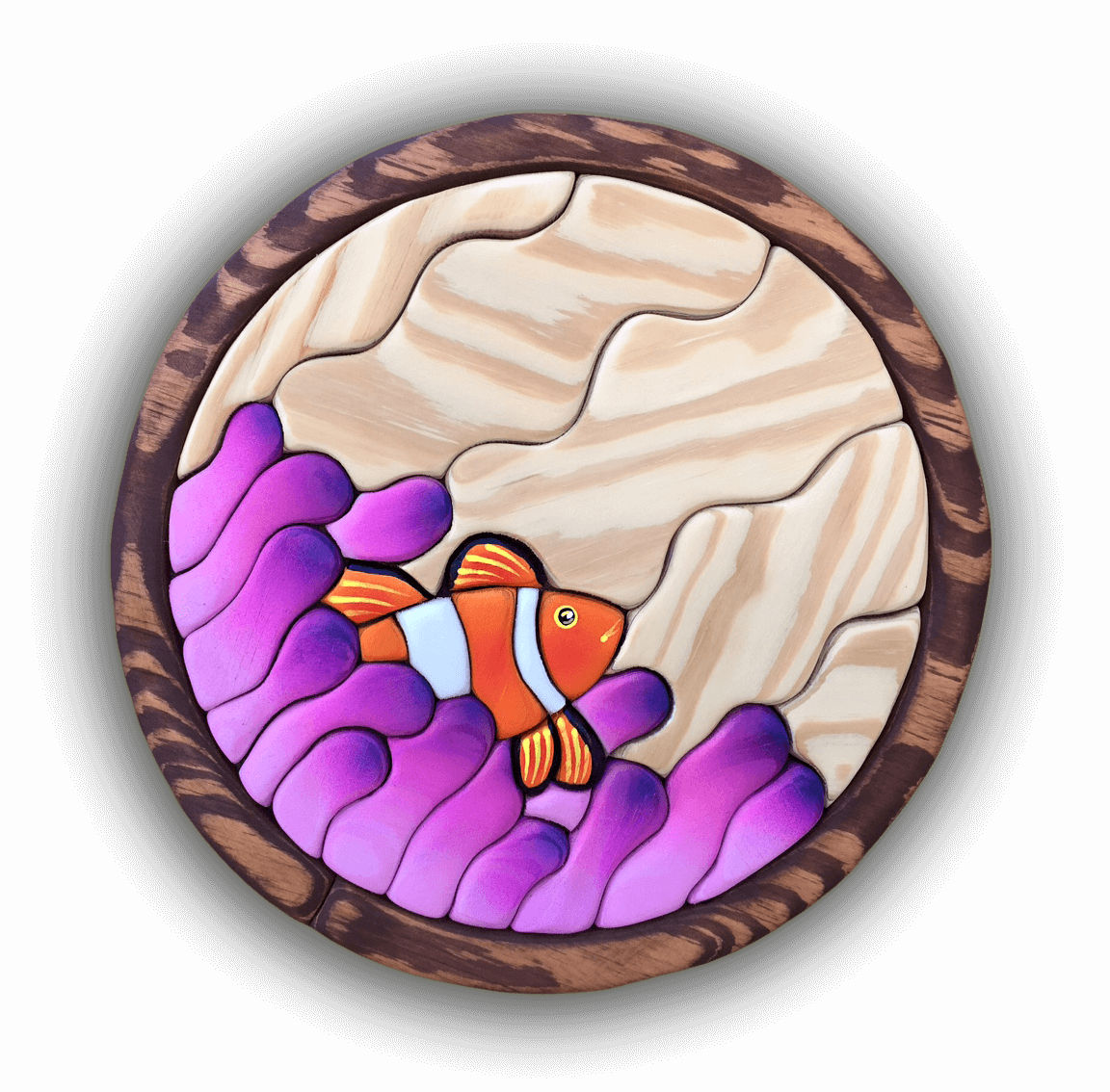 A custom Intarsia Art piece by Nick Vidakovic of a clown fish in the ocean