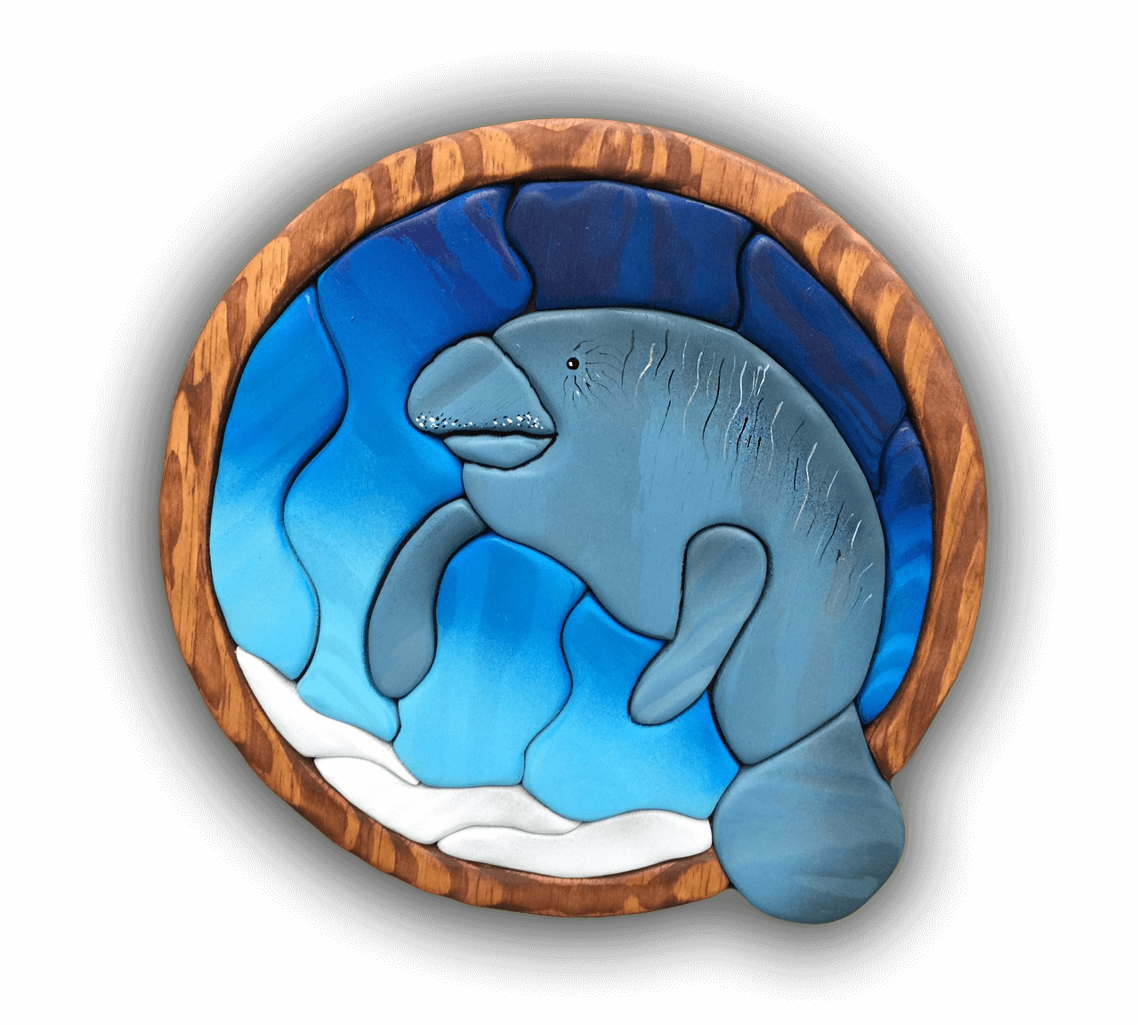 A custom Intarsia Art piece by Nick Vidakovic of a manatee 