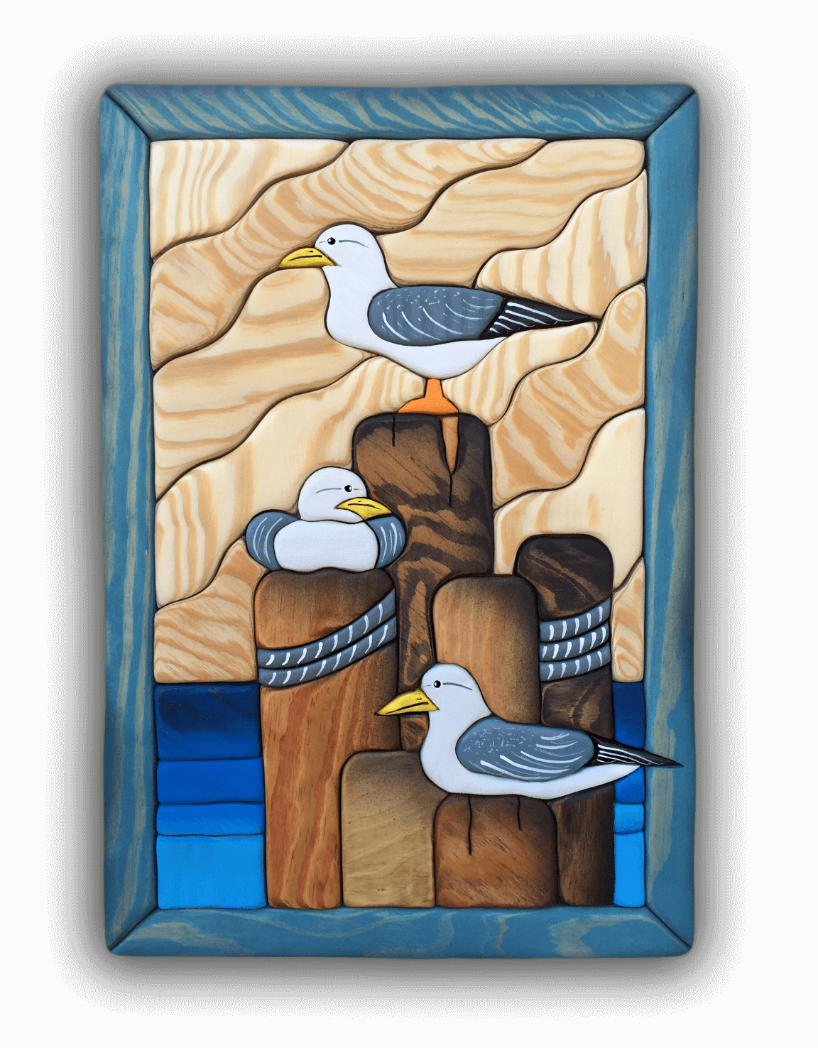 A custom Intarsia Art piece by Nick Vidakovic of seagulls sitting on wooden posts