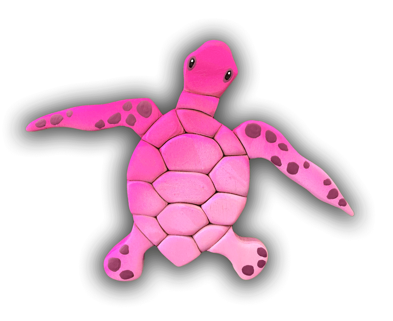 A pink sea turtle with black spots on its shell