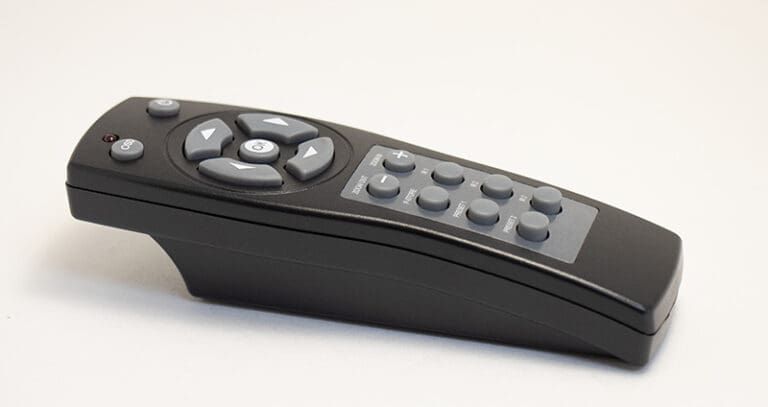 Black remote control with gray buttons.