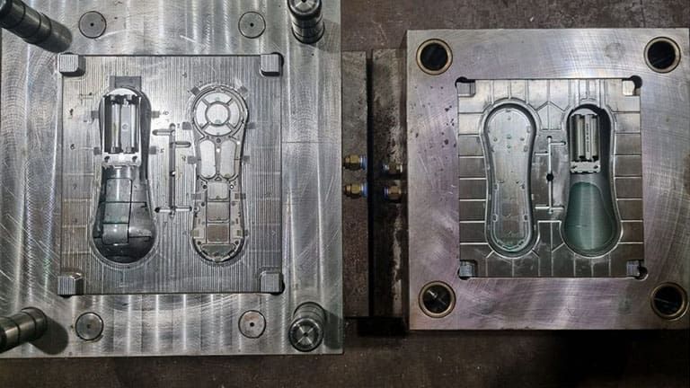 Two open metal injection molds for plastic parts.