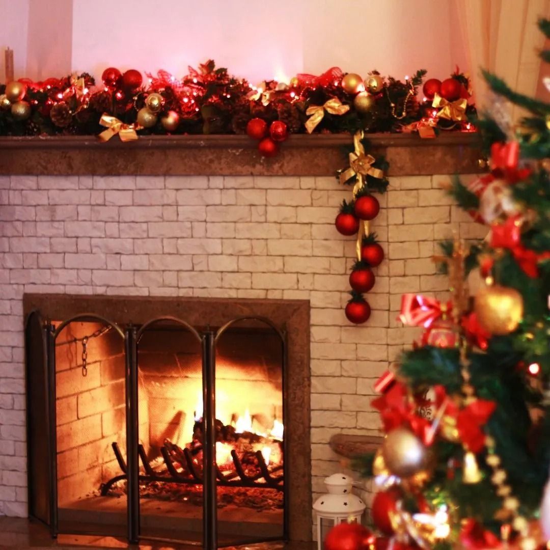 Kitchen with gray island, white countertops, sink, and views of a living area and outdoors.