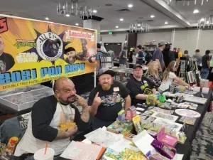 A Group Of Men Are Sitting — Aurora, CO — All C's Collectibles