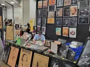 A Man Is Sitting At A Table — Aurora, CO — All C's Collectibles